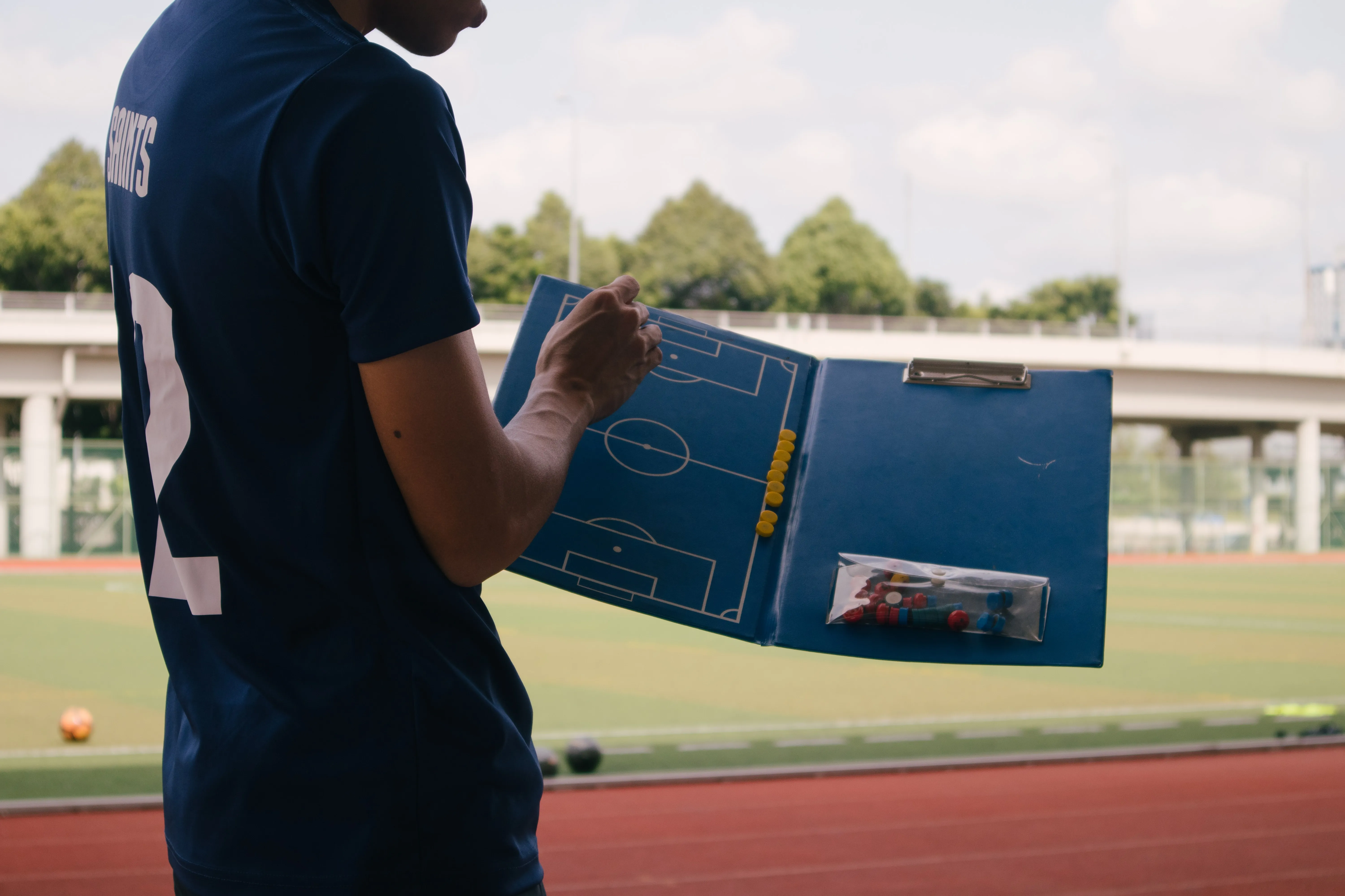 Coach reviewing business insurance options