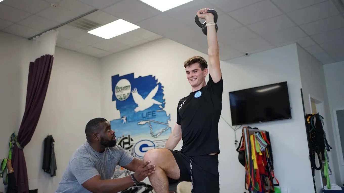 A coach training an athlete at NeoFit Performance