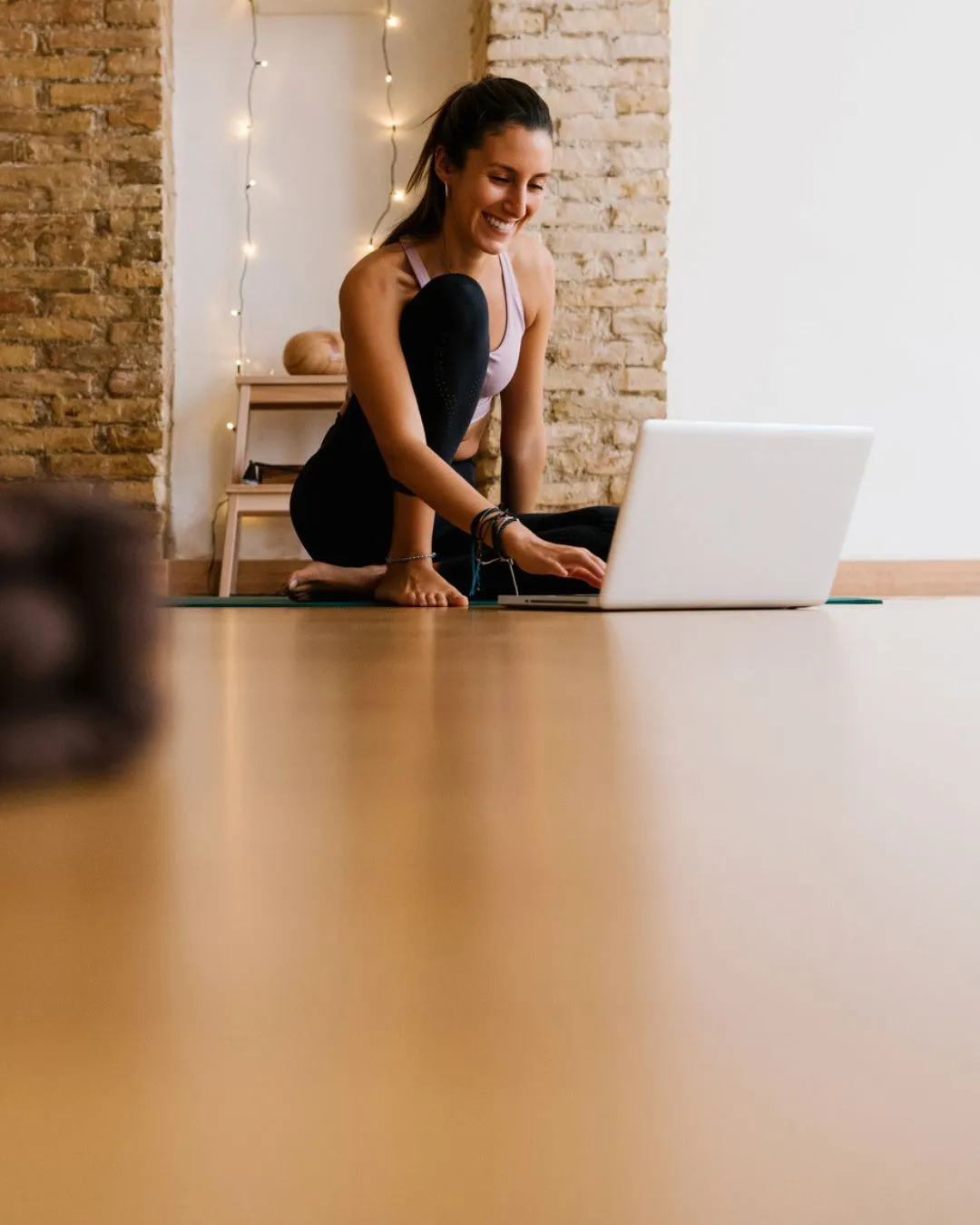 Studio owner using Zipper on a laptop