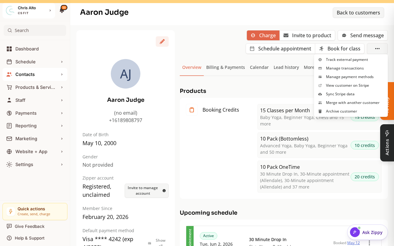 The customer action menu open, showing Merge with another customer among the options